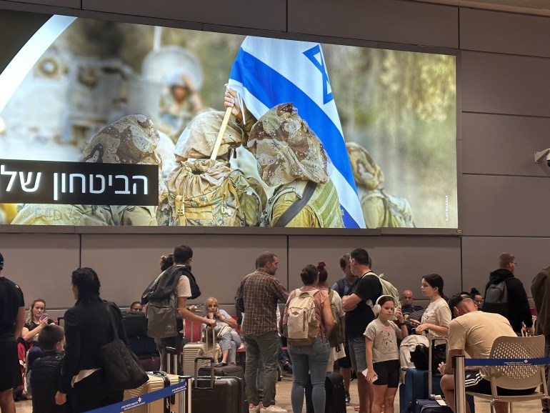 8979-1696804076 TEL AVIV, ISRAEL - OCTOBER 8: People wait in departing section at Ben Gurion Airport, Israel's only international airport, after many flights from abroad are cancelled due to the attacks launched by Palestinian factions in Tel Aviv, Israel on October 8, 2023. ( Turgut Alp Boyraz - Anadolu Agency )