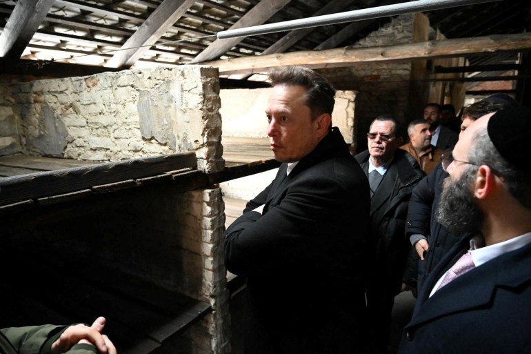 d8b3d8a8d984d8a8d8b3d98a3-1705986110 Elon Musk takes part in a private visit to Auschwitz-Birkenau with European Jewish Association (EJA) Chairman Rabbi Menachem Margolin, Ben Shapiro and Holocaust survivor Gidon Lev in Oswiecim, Poland January 22, 2024. European Jewish Association/Yoav Dudkevitch/Handout via REUTERS THIS IMAGE HAS BEEN SUPPLIED BY A THIRD PARTY. MANDATORY CREDIT NO RESALES. NO ARCHIVES