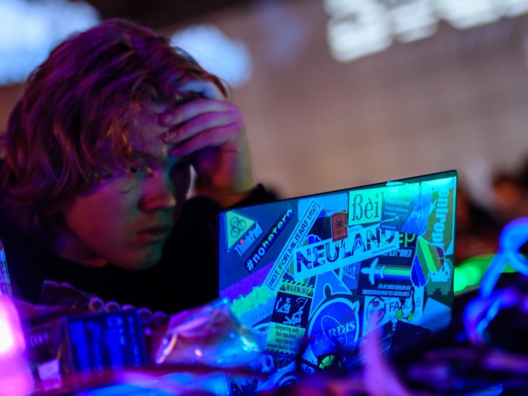 ea207019-e892-494b-a31b-bc8825c5d9c5 LEIPZIG, GERMANY - DECEMBER 27: A participant sits at a computer on the first day of the 35C3 Chaos Communication Congress on December 27, 2018 in Leipzig, Germany. The three-day event brings together 16,000 hackers, artists, researchers, technology fans and others from across the globe for seminars and workshops on privacy, security, social issues, ethics, government, science and other issues in their relation to digital technology. (Photo by Jens Schlueter/Getty Image