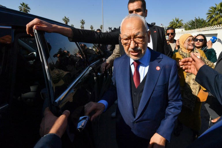339p86z-highres-1706854544 The head of Tunisia's Islamist movement Ennahdha Rached Ghannouchi greets supporters upon arrival to a police station in Tunis ,on February 21, 2023, in compliance to the summons of an investigating judge. (Photo by FETHI BELAID / AFP)