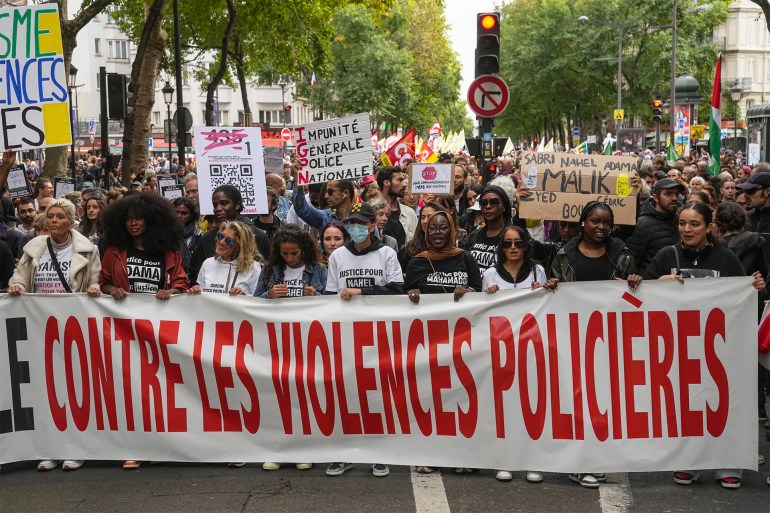 asasa-1695533758 1 of 9 | People march with a banner that reads, "against police violences," in Paris, Saturday, Sept. 23, 2023. Activists from community groups, far-left parties and unions have held marches around France against racism and police brutality. (AP Photo/Michel Euler)