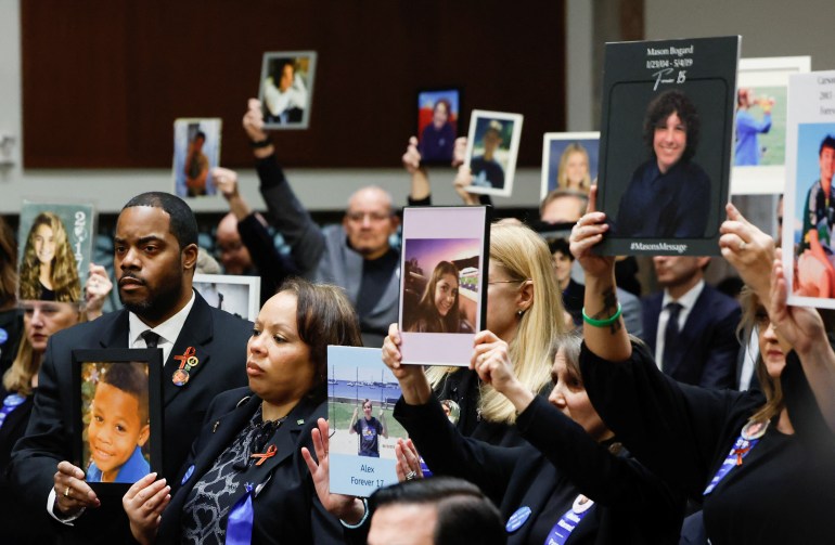 committee-hearing-8-1706797838 People hold up photographs and placards during the Senate Judiciary Committee hearing on online child sexual exploitation at the U.S. Capitol in Washington, U.S., January 31, 2024. REUTERS/Evelyn Hockstein