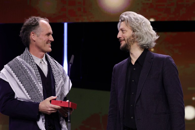 d8b3d98ad8b3d8b31-1709060513 BERLIN, GERMANY - FEBRUARY 24: Ben Russel and Guillaume Cailleau speak on stage after winning the Encounters Award for Best Film for the movie "DIRECT ACTION" at the Award Ceremony of the 74th Berlinale International Film Festival Berlin at Berlinale Palast on February 24, 2024 in Berlin, Germany. (Photo by Andreas Rentz/Getty Images)