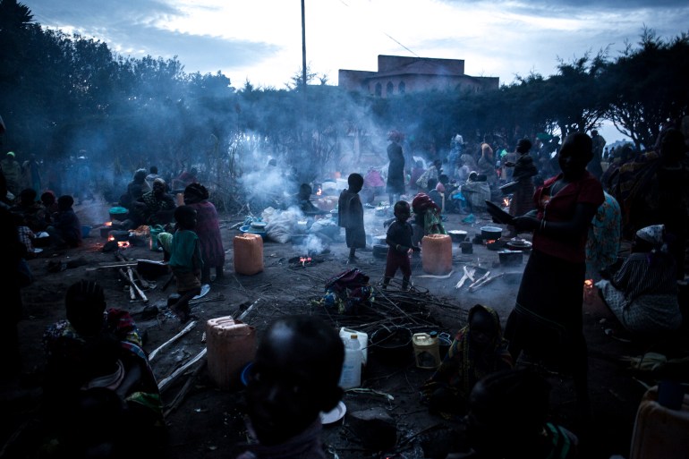 pic-6667777-1707939136 Thousands of displaced Congolese people take refuge in the grounds of a Catholic Church on July 3, 2019 in Drodro, eastern DR Congo. For the last three weeks the FARDC have been fighting in a offensive operation against a militia in the Wago Forest in the Djugu district of Ituria Province. Attacks by this militia and inter-communal fighting between the Lendu and Hema communities have displaced over 300 000 people so far. (Photo by John WESSELS / AFP)