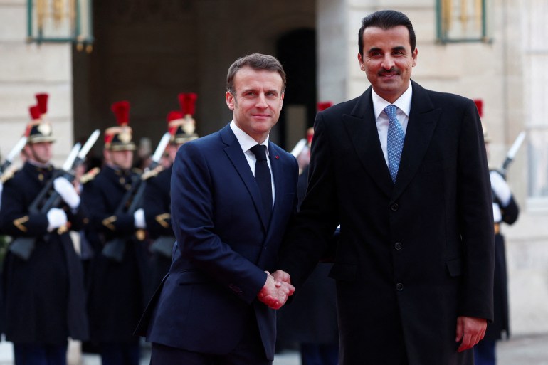 qatar2-1709064715 French President Emmanuel Macron shakes hands with Qatar's Emir Sheikh Tamim bin Hamad Al Thani as he arrives for a meeting at the Elysee Palace as part of a two day state visit in Paris, France, February 27, 2024. REUTERS/Gonzalo Fuentes