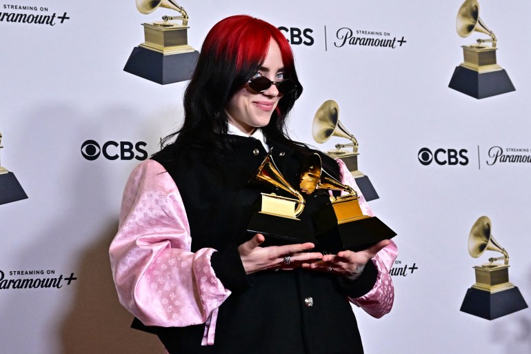 qqasdfgtrertghj-1707148172 US singer-songwriter Billie Eilish poses in the press room with the Grammys for Song of the Year and Best Song Written Visual Media for "What Was I Made For?" during the 66th Annual Grammy Awards at the Crypto.com Arena in Los Angeles on February 4, 2024. (Photo by Frederic J. Brown / AFP)
