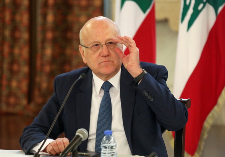 rts423fl Lebanese Prime Minister Najib Mikati attends a news conference on the latest developments in the country, at the governmental palace in Beirut