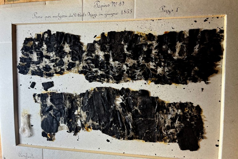 unrolled-orig-1707382241 Result of an attempt to physically unroll a scroll. Vesuvius Challenge