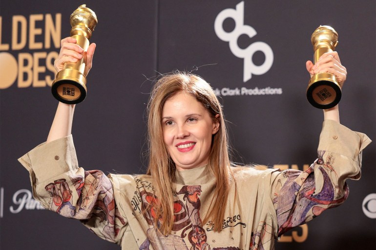 000000000-1709880051 epa11063523 French director Justine Triet holds the Golden Globe awards for Best Screenplay - Motion Picture and Best Motion Picture Non-English Language for the film 'Anatomy of a Fall' in the press room during the 81st annual Golden Globe Awards ceremony at the Beverly Hilton Hotel in Beverly Hills, California, USA, 07 January 2024. Artists in various film and television categories are awarded Golden Globes by the Hollywood Foreign Press Association. EPA-EFE/ALLISON DINNER