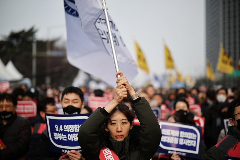 2024-03-03rea-healthcare-1709537658 Doctors take part in a rally to protest against government plans to increase medical school admissions in Seoul, South Korea, March 3, 2024. REUTERS/Kim Hong-Ji