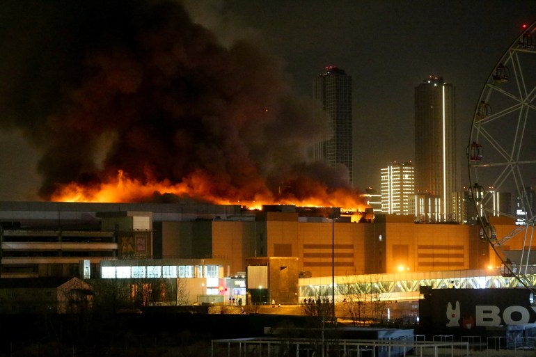 Smoke rises above the burning Crocus City Hall concert venue following a reported shooting incident, outside Moscow, Russia, March 22, 2024. Sergei Vedyashkin/Moscow News Agency/Handout via REUTERS ATTENTION EDITORS - THIS IMAGE HAS BEEN SUPPLIED BY A THIRD PARTY. MANDATORY CREDIT. /Handout via REUTERS THIS IMAGE HAS BEEN SUPPLIED BY A THIRD PARTY