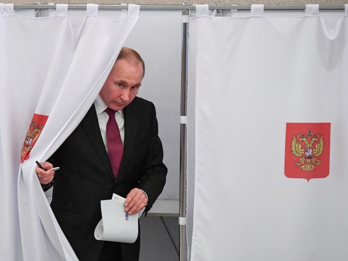 bc95b212-5958-4329-ae08-514f5253f446 Russian President and Presidential candidate Vladimir Putin at a polling station during the presidential election in Moscow, Russia March 18, 2018. Yuri Kadobnov/POOL via Reuters TPX IMAGES OF THE DAY