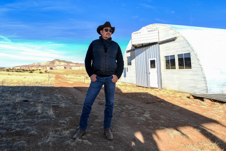 d9a4-1709573304 David Manzanares, actor, 2nd Unit Director, producer, location Manager poses on the set where director Christopher Nolan shot his Oscar nominated movie ìOppenheimerî, in Abiqui˙, New Mexico, on February 20, 2024. - An entire town filled with nuclear laboratories, built from scratch in the remote mountains of New Mexico, with every single person involved sworn to secrecy? It is not just the plot of "Oppenheimer," but also the story of how Christopher Nolan's Oscar-nominated movie about the invention of the atomic bomb was made. "This is the most I've ever spoken about it," said David Manzanares, field producer for Ghost Ranch, as he took AFP on a recent tour of the location for the movie's Los Alamos scenes. "It definitely took on the air of secrecy," he recalled. (Photo by VALERIE MACON / AFP)