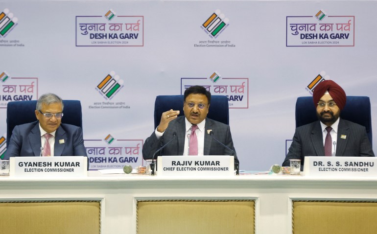 India's Chief Election Commissioner Rajiv Kumar speaks as Election Commissioners Gyanesh Kumar and S. S. Sandhu look on during a press conference in New Delhi, India, March 16, 2024. REUTERS/Adnan Abidi