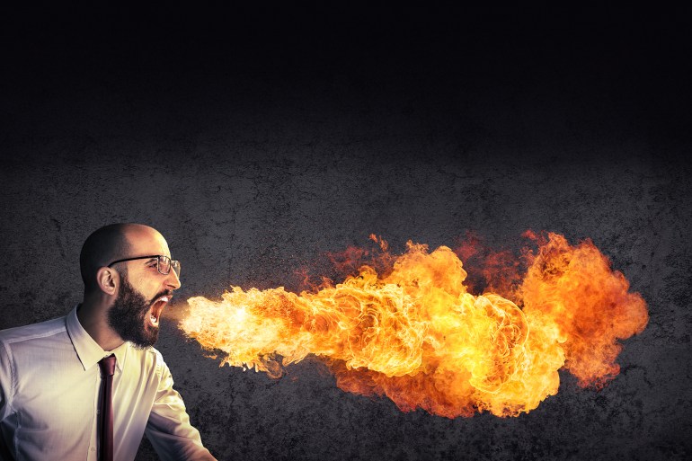 shutterstock_310321334-1711735423 angry and furious announcement - businessman spitting fire