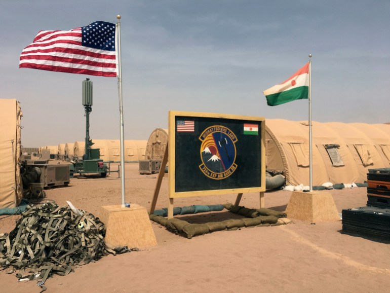 ap18113333388430-1695847304-1 In this photo taken Monday, April 16, 2018, a U.S. and Niger flag are raised side by side at the base camp for air forces and other personnel supporting the construction of Niger Air Base 201 in Agadez, Niger. On the scorching edge of the Sahara Desert, the U.S. Air Force is building a base for armed drones, the newest front in America's battle against the growing extremist threat in Africa's vast Sahel region. Three hangars and the first layers of a runway command a sandy, barren field. Niger Air Base 201 is expected to be functional early next year. (AP Photo/Carley Petesch)