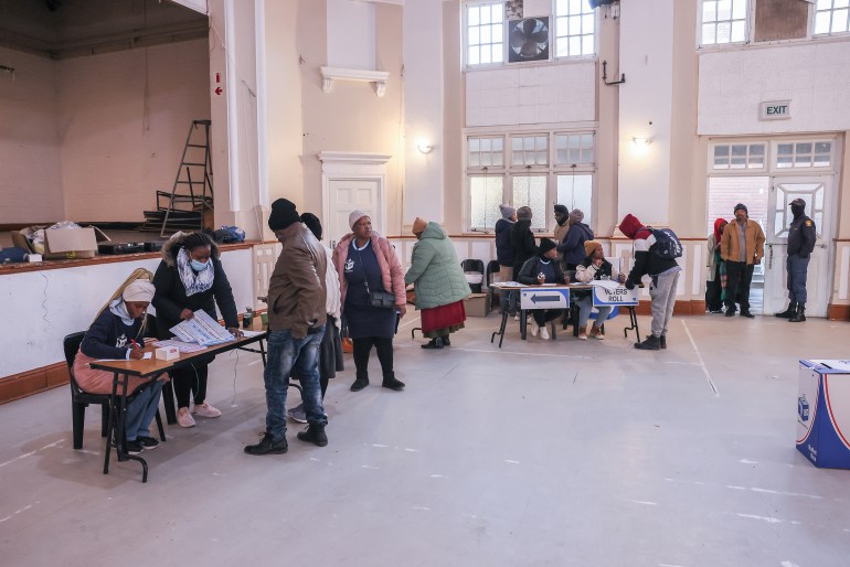 gettyimages-2155118907-1716971395 VARIOUS CITIES, SOUTH AFRICA - MAY 29: Residents of Matatiele collect ballots from IEC workers in Matatiele Town Hall to cast the ballots in the National Election May 29, 2024 in Matatiele, South Africa. South Africa's national and provincial elections were held today to elect a new National Assembly and provincial legislature in each of the nine provinces. Results will be officially announced on June 2. (Photo by J. Countess/Getty Images)