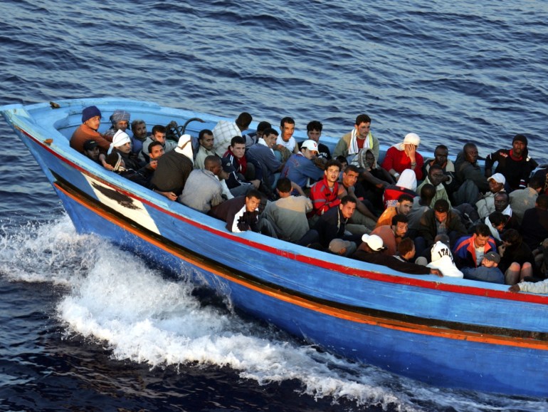 LAMPEDUSA, ITALY - JUNE 21: A boat loaded with illegal immigrant is seen on June 21, 2005 in Lampedusa, Italy. Tens of thousands of immigrants land on the Italian coast each year, most of them heading from north Africa on ramshackle boats.In the Mediterranean Sea between Malta and Tunisia, Lampedusa Island is one of the main gateways for illegal immigration from Africa into Europe. According to a report by Amnesty International, Illegal immigrants who land in Italy consistently allege they have been abused, holding centres are overcrowded and no legal assistance is offered. Italian authorities refused to give access to the centres to enable further investigations by Amnesty. The Amnesty International report says 15,647 people were held in the centres in 2004: a 9 per-cent increase on the previous year. (Photo by Marco Di Lauro/Getty Images)