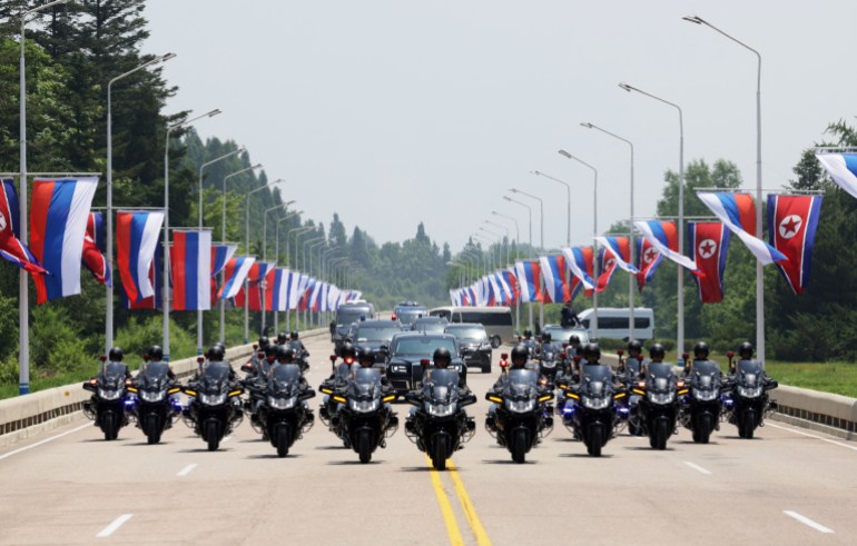 20sia-1718779387-1 A motorcade with Russia's President Vladimir Putin and North Korea's leader Kim Jong Un moves along a road in Pyongyang, North Korea June 19, 2024. Sputnik/Gavriil Grigorov/Pool via REUTERS ATTENTION EDITORS - THIS IMAGE WAS PROVIDED BY A THIRD PARTY.
