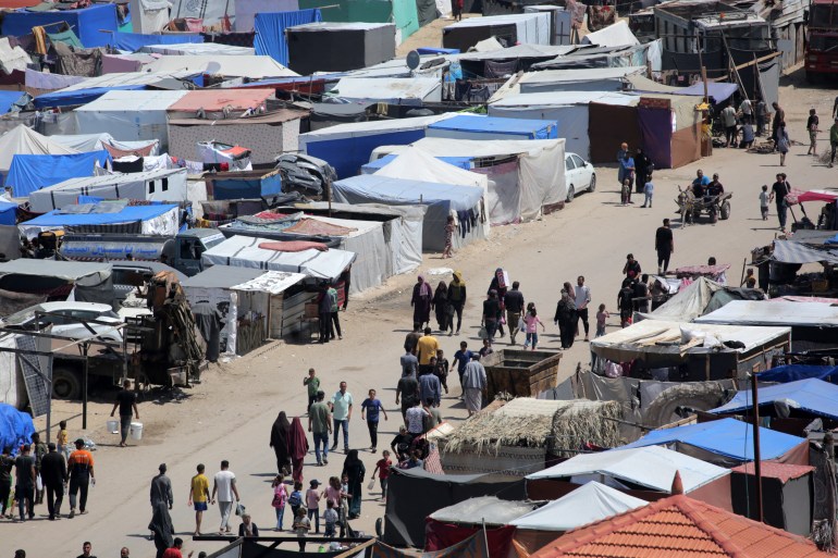 Tents are set up along a street in Deir el-Balah in the central Gaza Strip by Palestinians who fled Rafah in the southern part of the Palestinian territory on May 12, 2024, amid the ongoing conflict between Israel and the Hamas militant group. (Photo by AFP) / The erroneous mention[s] appearing in the metadata of this photo by Said KHATIB has been modified in AFP systems in the following manner: [stringer] instead of [Said Khatib]. Please immediately remove the erroneous mention[s] from all your online services and delete it (them) from your servers. If you have been authorized by AFP to distribute it (them) to third parties, please ensure that the same actions are carried out by them. Failure to promptly comply with these instructions will entail liability on your part for any continued or post notification usage. Therefore we thank you very much for all your attention and prompt action. We are sorry for the inconvenience this notification may cause and remain at your disposal for any further information you may require.
