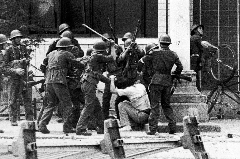 Chinese riot police beat student protestors during the Tiananmen Square protests of April-June 1989 in Beijing, China. (Photo by Peter Turnley/Getty Images)