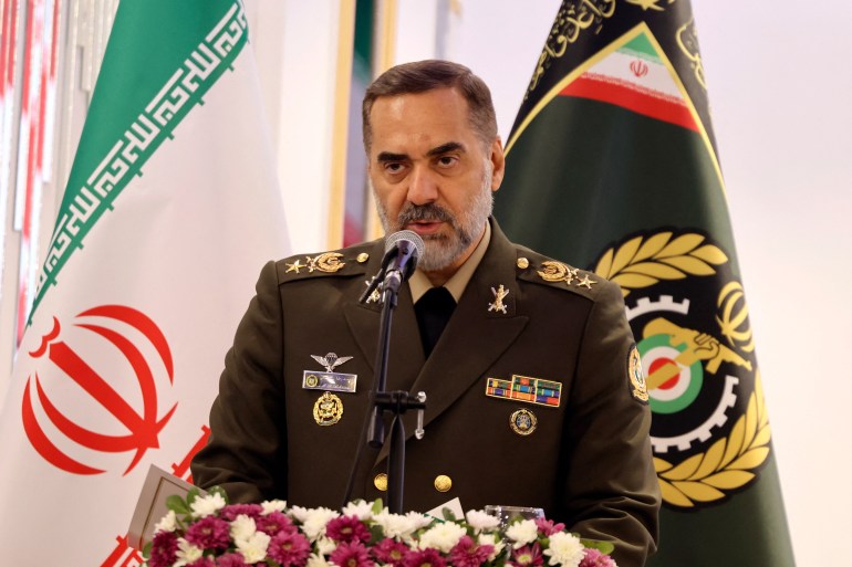 Iranian Defence Minister Mohammad Reza Ashtiani speaks during Iran's defence industry achievements exhibition, on August 23, 2023 in Tehran. Iran unveiled on August 22 its latest domestically built drone that can fly at a higher altitude and for a longer duration with enhanced weapons capabilities, state media reported. (Photo by ATTA KENARE / AFP)
