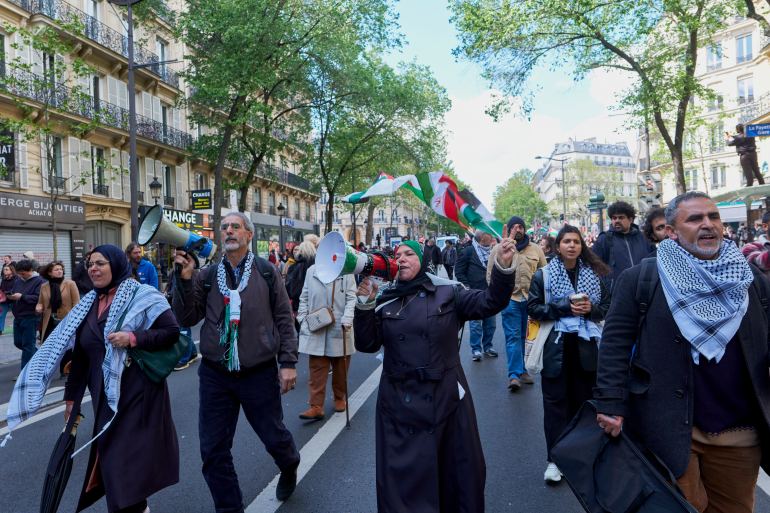 pic-766558-1718473218 PARIS, FRANCE - APRIL 21: A woman chants slogans in favour of Palestine during a march against racism and Islamophobia on April 21, 2024 in Paris, France. The march was initially banned by authorities because of a potential "danger to public order", but a last-minute appeal by the organisers was granted to allow the march to go ahead. Fifty one organisations, including the far-left La France Insoumise (France Unbowed) party called for people to join the rally, which also includes the denunciation of police violence, especially in France's marginalised urban areas. (Photo by Remon Haazen/Getty Images)