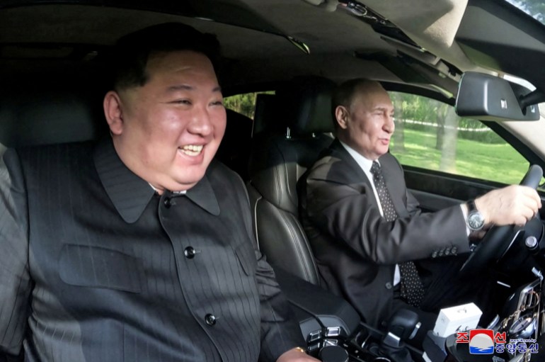 Russia's President Vladimir Putin and North Korea's leader Kim Jong Un ride an Aurus car in Pyongyang, North Korea in this image released by the Korean Central News Agency June 20, 2024. KCNA via REUTERS ATTENTION EDITORS - THIS IMAGE WAS PROVIDED BY A THIRD PARTY. REUTERS IS UNABLE TO INDEPENDENTLY VERIFY THIS IMAGE. NO THIRD PARTY SALES. SOUTH KOREA OUT. NO COMMERCIAL OR EDITORIAL SALES IN SOUTH KOREA. TPX IMAGES OF THE DAY