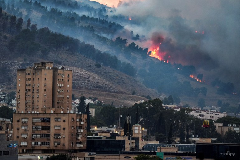 Smoke and fire covers the area following rocket attacks from Lebanon, amid ongoing cross-border hostilities between Hezbollah and Israeli forces, near Kiryat Shmona, Israel, close to its border with Lebanon, June 3, 2024. REUTERS/Ayal Margolin ISRAEL OUT. NO COMMERCIAL OR EDITORIAL SALES IN ISRAEL TPX IMAGES OF THE DAY