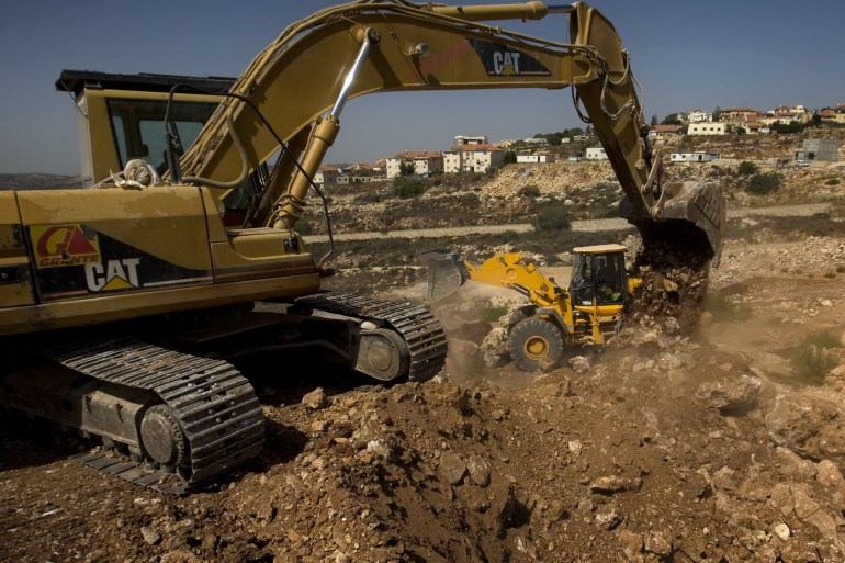 Israel Settlement Revisited In this photo taken Tuesday, Sept. 28, 2010, workers use ground moving equipment at a construction site in the Jewish settlement of Revava, near the West Bank city of Nablus. - رويترز