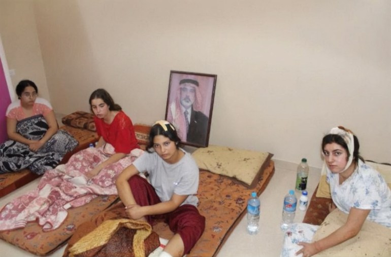 An undated handout picture provided on July 16, 2024 by The Hostages Families Forum Headquarters, representing families of Israeli hostages held by Palestinian militants in Gaza, shows hostages (L - R) Liri Albag, Agam Berger, Daniella Gilboa, and Karina Ariev, at an unknown location during the early days of captivity. The families of five female Israeli soldiers held hostage in the Gaza Strip since October, pleaded with Israel's Prime Minister on July 16 to reach a deal with the Palestinian militant group Hamas for their release. (Photo by the Hostages Families Forum Headquarters / AFP) / RESTRICTED TO EDITORIAL USE - MANDATORY CREDIT "AFP PHOTO / THE HOSTAGES FAMILIES FORUM HEADQUARETRS" NO MARKETING NO ADVERTISING CAMPAIGNS - DISTRIBUTED AS A SERVICE TO CLIENTS
