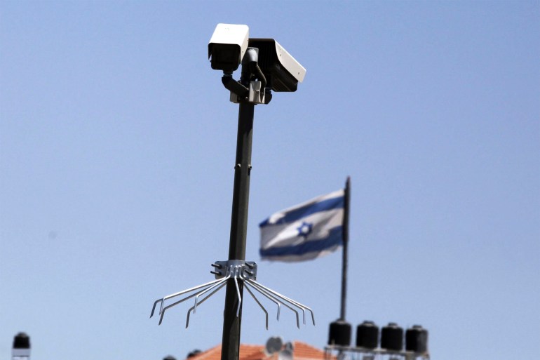 gettyimages-1349953768 A Surveillance camera is seen at the Mount of Olives with an Israeli flag in the background on May 16, 2012 in Jerusalem, Israel. gettyimages-1349953768