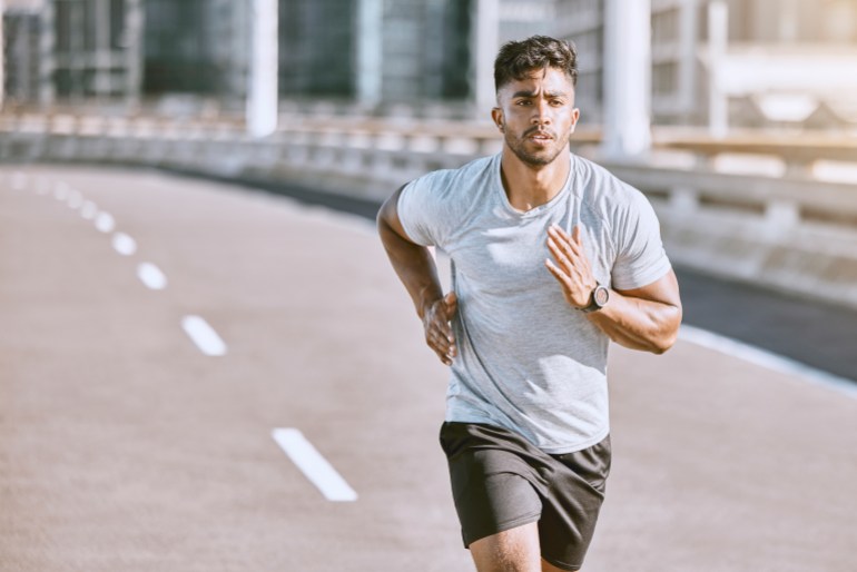 gettyimages-1420515189-1718138491 Exercise, workout and training with a healthy man training for sport, fitness and wellness outside in the city. Running, exercising and working out with motivation for lifestyle, health and sports