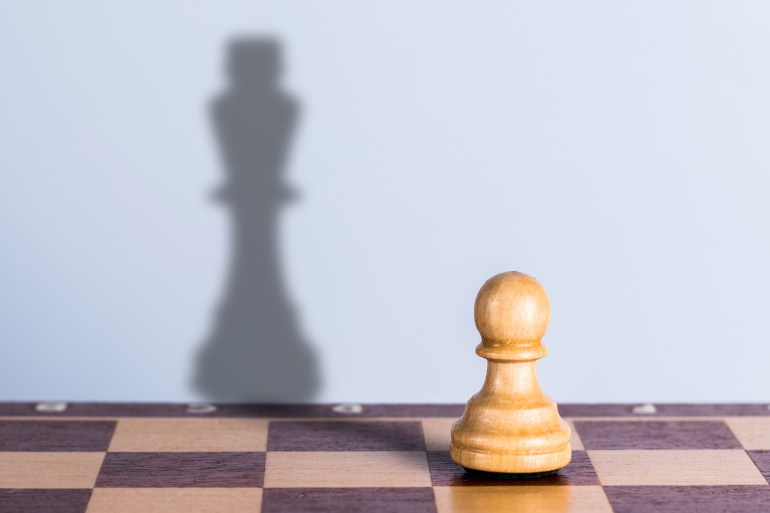 shutterstock_1354307015-1721668715 White chess pawn with king shadow. Hidden opportunities concept
