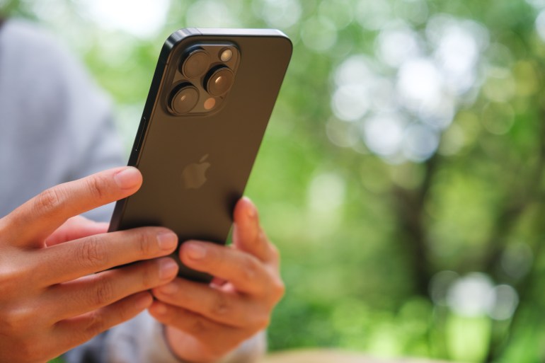 shutterstock_2478932991-1720351330 Jun 12th 2024 : A woman holding and using Iphone 15 Pro Max smart phone, Chiang mai Thailand