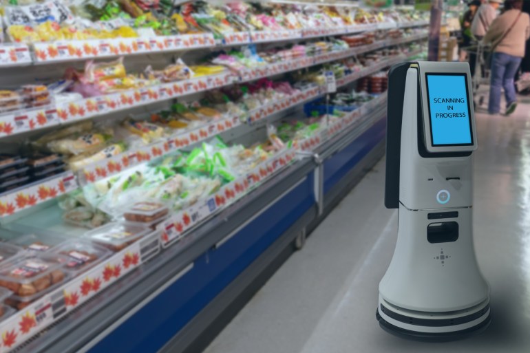 0236-1724785351 smart retail concept, robot service use for check the data of or Stores that stock goods on shelves with easily-viewed barcode and prices or photo compared against an idealized representation of store شترستوك