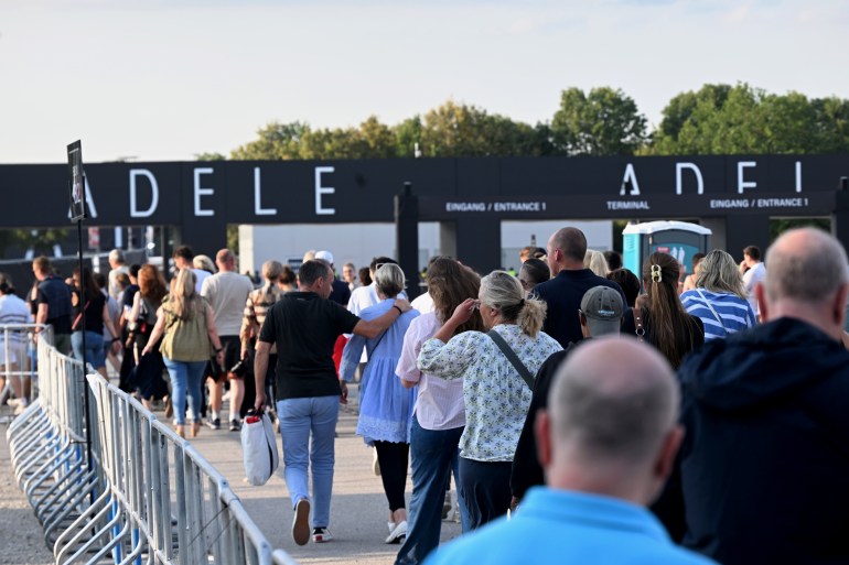 02 August 2024, Bavaria, Munich: Visitors are on their way to a concert by British singer Adele. Photo: Felix Hörhager/dpa (Photo by Felix Hörhager/picture alliance via Getty Images)