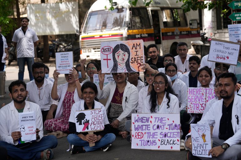 Resident doctors and medical students stage a protest against the alleged rape and killing of a doctor, at Kolkata's RG Kar Medical College and Hospital in Mumbai, India, Saturday, Aug. 17, 2024. (AP Photo/Rajanish Kakade)