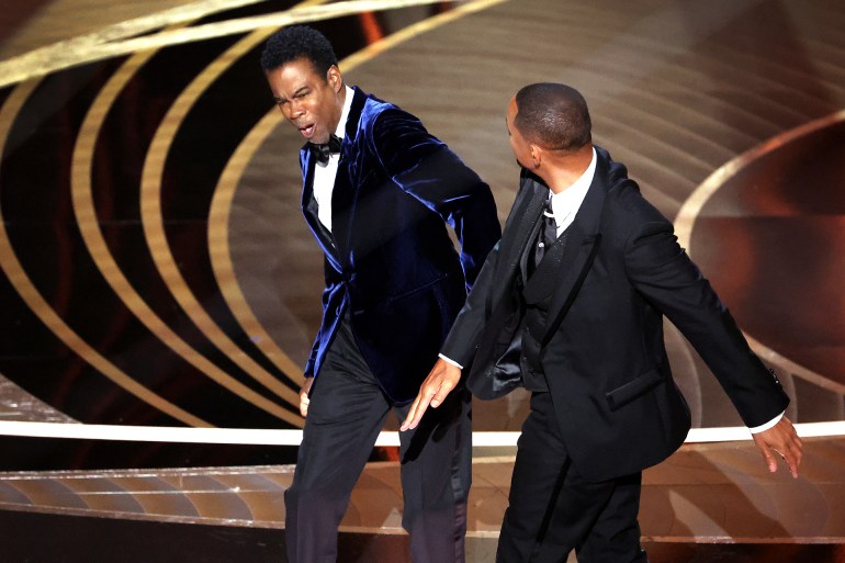 HOLLYWOOD, CA - March 27, 2022. Chris Rock and Will Smith onstage during the show at the 94th Academy Awards at the Dolby Theatre at Ovation Hollywood on Sunday, March 27, 2022. (Myung Chun / Los Angeles Times via Getty Images)