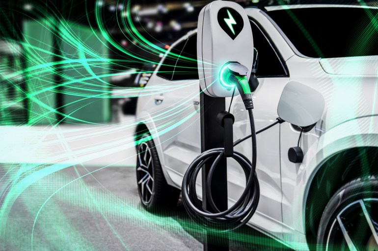 gettyimages-1348631007-1717091079 EV charging station for electric car in concept of green energy and eco power produced from sustainable source to supply to charger station in order to reduce CO2 emission .