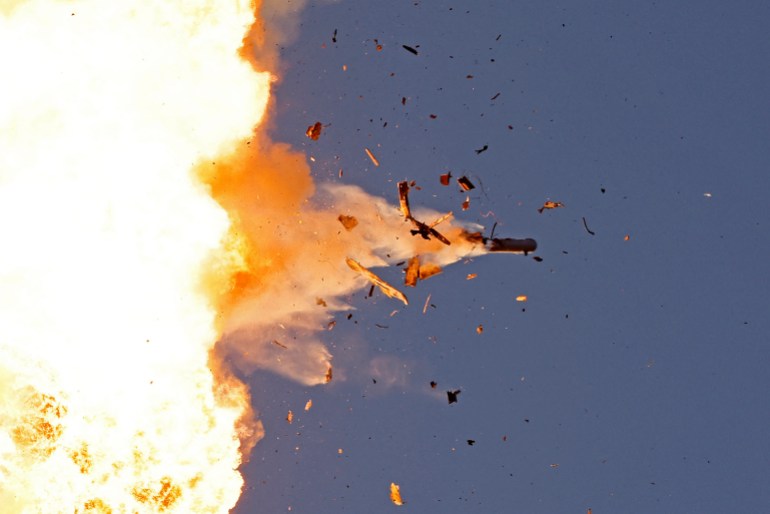 This photo taken from a position in northern Israel shows a Hezbollah UAV intercepted by Israeli air forces over north Israel on August 25, 2024. - The Israeli military announced early August 25, 2024 that it was conducting pre-emptive strikes in Lebanon after detecting preparations for "large-scale" attacks by the Iran-backed militant group Hezbollah. Hezbollah said August 25, 2024 it had launched more than 320 rockets at Israel overnight, targeting a string of military positions, even as Israel's military said it was carrying out pre-emptive strikes against the group. (Photo by Jalaa MAREY / AFP)