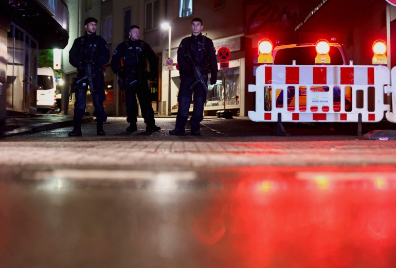 Police officers secure the area of an incident, after several individuals were killed on Friday night when a man randomly stabbed passers-by with a knife, at a city festival in Solingen, Germany, August 24, 2024. REUTERS/Thilo Schmuelgen
