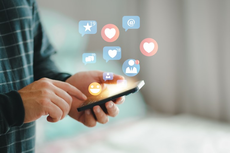 sxsxs3-1723125307 Young man using smart phone, Social media concept. smartphone and show technology icon social media..