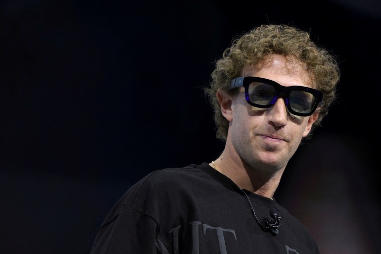 Meta CEO Mark Zuckerberg tries on Orion AR glasses at the Meta Connect annual event at the company's headquarters in Menlo Park, California, U.S., September 25, 2024. REUTERS/Manuel Orbegozo TPX IMAGES OF THE DAY