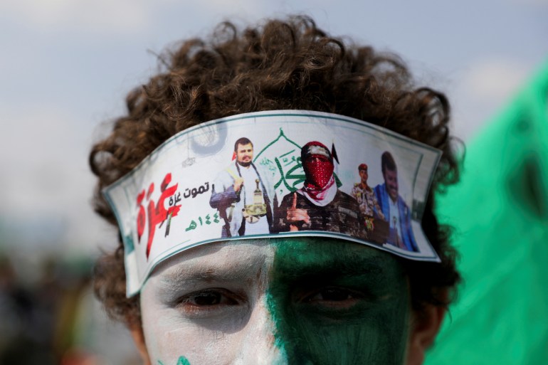 pic-5646511-1726511561 A Houthi supporter with a headband featuring photos of Houthi leader, Abdul-Malik al-Houthi, and spokesman for the Hamas military wing, Abu Ubaidah, attends a rally to mark the anniversary of the birth of the Prophet Mohammad and to show solidarity with Palestinians in the Gaza Strip, in Sanaa, Yemen, September 15, 2024. REUTERS/Khaled Abdullah