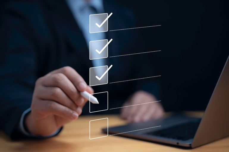 work5-1727362059 Check list concept.Businessman using laptop with online checklist survey, filling out digital form checklist, take an assessment, questionnaire, evaluation, online survey, online exam; Shutterstock ID 2400635831; purchase_order: aljazeera ; job: ; client: ; other: