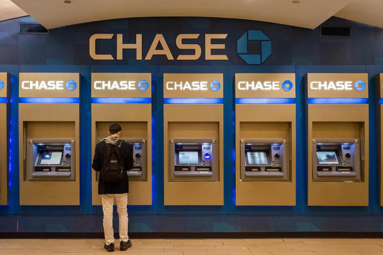 cards6-1728051353 Man Standing near ATMs