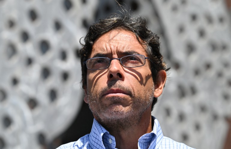 Mark Chavez, the "ketamine doctor" who is charged in connection with actor Matthew Perry's death from an accidental ketamine overdose, listen to his attorney Matthew Binninger speak to the media as they leave the Roybal Federal Courthouse in Los Angeles after his court appearance on August 30, 2024. - A doctor who has agreed to plead guilty in connection with the overdose death of "Friends" actor Matthew Perry was ordered on August 30 by a judge not to practice medicine.