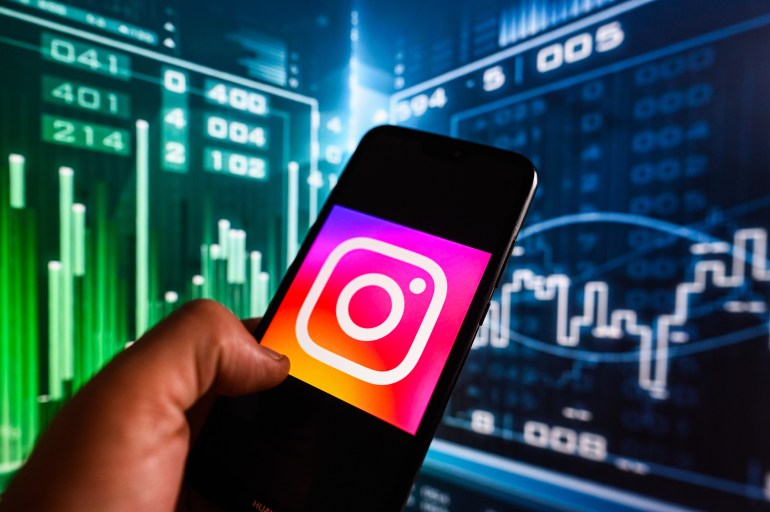 POLAND - 2023/08/01: In this photo illustration, an Instagram logo displayed on a smartphone with stock market percentages in the background. (Photo Illustration by Omar Marques/SOPA Images/LightRocket via Getty Images)