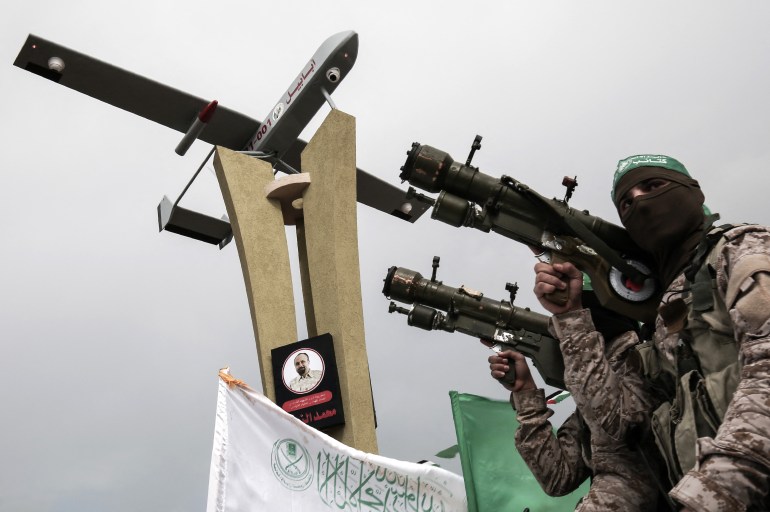 l97jg-highres-1697207496 Members of the Ezzedine al-Qassam Brigades, the military wing of the Palestinian Islamist movement Hamas, attend a memorial in the southern Gaza Strip town of Rafah on January 31, 2017, for Mohamed Zouari, a 49-year-old Tunisian engineer and drone expert, who was murdered at the wheel of his car outside his house in Tunisia in December 2016. The armed wing of Hamas said that the Jewish state was responsible for the murder in eastern Tunisia, of Mohamed Zaouari, described as a leader of the Islamist movement specializing in the development of drones. (Photo by SAID KHATIB / AFP)